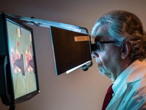 MONTREAL, QUE.: OCTOBER 22, 2014 -- Dr. Rolando Del Maestro demonstrates the use of the NeuroTouch neurosurgery simulator at the McGill University Neurological Simulation Research Centre in Montreal on Wednesday, October 22, 2014. (Dario Ayala / Montreal Gazette)