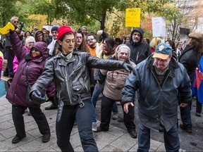 Project Genesis organized a zombie march at Dorchester Square in Montreal, on Thursday, October 23, 2014 to bring attention to the slow pace of hearings at the Regie du Logement.