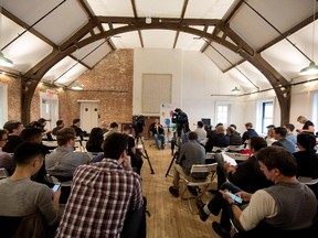 A group listen to a Google for Business presentation at the former Notman House in Montreal on Friday October 24, 2014.