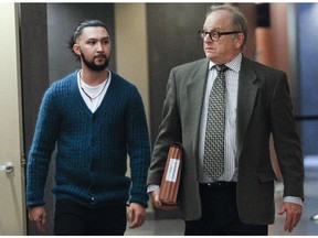 MONTREAL, QUE.:  OCTOBER 24, 2014 -- Arif Afghani, left, is walking with his lawyer Jeffrey Boro on the fifth floor of the Montreal Courthouse on Friday afternoon. Afghani had a court hearing today where he is expected to plead guilty to dangerous driving causing the deaths of a father and daughter in St. Laurent. Afghani is not detained. (Marie-France Coallier/ Montreal Gazette).
