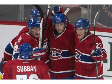 Montreal Canadiens Lars Eller (81) celebrates his 2nd-period goal against the New York Rangers, with teammates in Montreal  on Saturday, October 25, 2014.