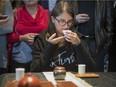Coline lleren checks the aroma of one of the Dong Ding Oolong tea, served to her during a tea ceremony held at the SAT Foodlab in Montreal on Sunday, October 26, 2014.