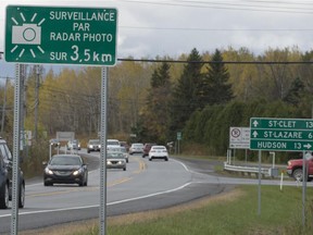 New signs posted along Cite des Jeunes Blvd.in St Lazare indicating that photo radar cameras now monitor drivers for speed.