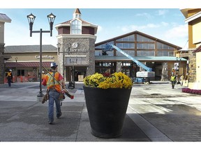 Workers are rushing to finish the installation of the new shops at Premium Outlet Montreal mall in Mirabel, north of Montreal.It is set to open on Oct. 30, 2014.