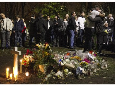 Monique Dalcourt, mother of Jenique, shares a hug during memorial for Jenique Dalcourt on Tuesday October 28, 2014. The 23-year-old woman was killed last week in Longueuil while riding her bike.