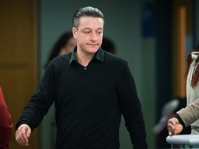 Jonathan Mignacca arrives for his trial at the Laval courthouse in Laval on Wednesday, October 29, 2014.