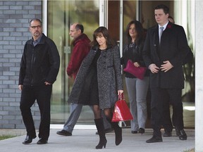 Mourners leave the visitation of fallen soldier Warrant Officer Patrice Vincent at the Yves Legare funeral complex in Longueuil, south of Montreal on Friday, Oct. 31, 2014. Vincent, 53, was killed when he was hit with a car in St-Jean-sur-Richellieu by attacker Martin Rouleau.