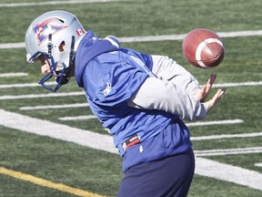 Alouettes kicker Sean Whyte plays with a football during practice in St-Léonard on Oct. 31, 2014, as the club prepared to face the Toronto Argonauts on Sunday, November 2, 2014.