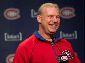 Canadiens coach Michel Therrien has a laugh while taking questions from the media at Brossard's Bell Sports Complex on Oct. 7, 2014.