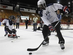 Montreal Canadiens defenceman P.K. Subban plays a little shinny with kids in  Verdun in 2012.