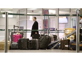 MONTREAL, QUE: THURSDAY MARCH 03, 2010. -- Passengers who have just arrived at Trudeau Airport in MOntreal, where Police held a press conference about major police operation at the airport involving thefts from luggage, enter the bagage claim area on Thursday, March 4, 2010. (THE GAZETTE/Peter McCabe)