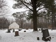 The defiled cemetery at the historic St-John's Anglican Church near Lachute in 2010. The simple county church was deconsecrated because it had become the target of vandals.