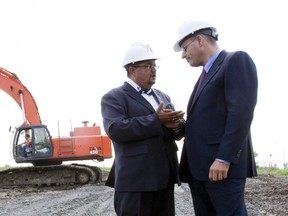 Former MUCH CEO Arthur Porter, left, talks with Riadh Ben Aissa as construction started at the McGill University Health Centre superhospital at the Glen Campus in Montreal in 2010.
