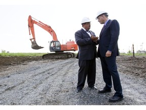 MUHC CEO Dr. Arthur Porter (left) talks with Riadh Ben Aissa, executive v.p. SNC Lavalin, as construction started at the McGill University Health Centre super hospital at the Glen Campus in 2010