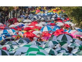 Montrealers took the streets with their umbrellas to launch the annual Centraide fundraising campaign on Thursday, October 2, 2014.