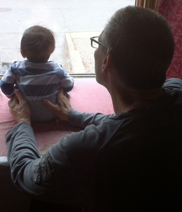 Natey sitting with his Zadie watching for Mommy to get home.