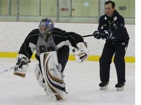 Sherwood Park, ALTA. JULY 06, 2009 - Goalie #60 Andrew Perugini pulls along goalie coach Frederic Chabot during the Oilers develoment camp Monday at Millenium Place in Sherwood Park, July 06/09. (photo by Rick MacWilliam / Edmonton Journal)(for story by Joanne Ireland)