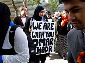 Supporters rally outside the Edmonton courthouse during former Guantanamo Bay inmate Omar Khadr's court appearance in Edmonton, Alberta on Monday September 23, 2013.