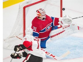 Ottawa Senators centre Kyle Turris, bottom, misses a shot against Montreal Canadiens goalie Carey Price, top, during the second period of their preseason NHL hockey match at the Bell Centre in Montreal on Saturday, October 4, 2014.