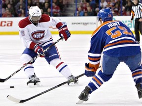 Montreal Canadiens' P.K. Subban tries to beat Edmonton Oilers' Brad Hunt as he defends during first-period action in Edmonton on Monday, Oct, 27, 2014.
