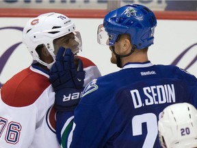 The Canadiens' P.K. Subban and the Canucks' Daniel Sedin exchange words during game in Vancouver on Oct. 30, 2014. The Canucks won 3-2 in a shootout.