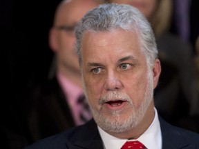 Quebec Premier Philippe Couillard speaks at a news conference following his first cabinet meeting, Thursday, April 24, 2014 at his office in Quebec City.