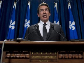 Quebec Opposition and Parti Quebecois MNA Pierre-Karl Peladeau speaks to reporters Wednesday, October 8, 2014 at the legislature in Quebec City.