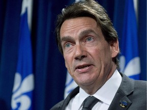 Parti Québécois MNA Pierre-Karl Péladeau speaks to reporters Wednesday, October 8, 2014 at the legislature in Quebec City.