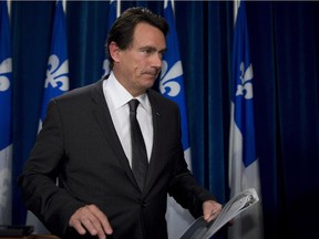 Quebec Opposition and Parti Quebecois MNA Pierre-Karl Peladeau leaves after speaking to reporters Wednesday, October 8, 2014 at the legislature in Quebec City.