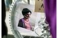 A portrait of Mathilde Blais is seen in the spokes of a “ghost bike” during a memorial vigil on St. Denis St. at the St. Denis St. underpass in Montreal Monday, May 5, 2014.