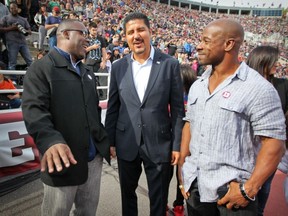 Former Als' running-back Mike Pringle (right), shares a laugh with quarterbacks Tracy Ham (left) and Anthony Calvillo Monday at Molson Stadium.
John Mahoney/The Gazette