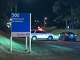 Police cars are shown in front of the Orsainville Detention Centre near Quebec City on Saturday June 7, 2014. There has been another jailbreak in Quebec involving a helicopter. Quebec Provincial Police say three inmates have escaped from the Orsainville Detention Centre.