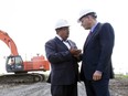 Former MUHC CEO Dr. Arthur Porter, left, talks with Riadh Ben Aïssa, formerly of SNC-Lavalin, as construction started at the McGill University Health Centre superhospital at the Glen Campus in Montreal in  June of 2010.