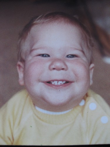 Simon was a happy baby, always smiling...here he is about 9 months old with 8 teeth : )