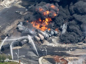 Smoke rises from tanker cars in downtown Lac-Megantic, Que., on July 6, 2013.