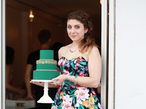 Milène Laoun, owner of vegan bakery Sophie Sucrée, holding one of her creations. 
(Photo by Monique Simone)