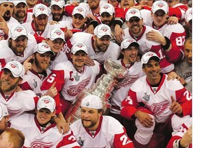 The Detroit Red Wings pose for a team photo with the Stanley Cup after their victory in 2008, the club's fourth title since 1997.