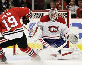 Montreal Canadiens goalie Carey Price blocks a shot by Chicago Blackhawks centre Jonathan Toews during the second period of a preseason NHL hockey game in Chicago, Wednesday, Oct. 1, 2014. (AP Photo/Nam Y. Huh)