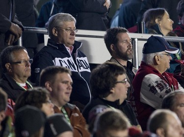 Prime Minister Stephen Harper takes in a CFL game as the Ottawa Redblacks take on the Montreal Alouettes in Ottawa on Friday, Oct. 24, 2014.