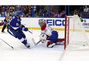 Tampa Bay Lightning's Steven Stamkos scores past Montreal Canadiens' Carey Price during the second period on Monday, Oct. 13, 2014, in Tampa, Fla.