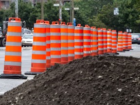 FILE — Construction cones line Rene Levesque Blvd east of Atwater Street in Montreal, on Aug. 21, 2014.