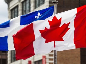 The Quebec and Canadian flags in Montreal on Thursday, August 28, 2014.