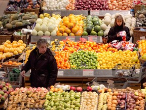 In this file photo, shoppers are in the produce section at the Loblaws at the old Angus shops in Montreal Thursday, February 13, 2014.