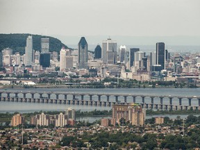An aerial view of the Montreal skyline with a portion of the Champlain bridge seen from the South Shore of Montreal on Thursday, June 20, 2013.