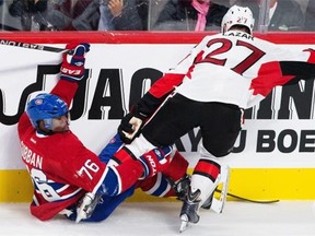 P. K. Subban falls after colliding with Curtis Lazar of the Ottawa Senators during the third period of their preseason match at the Bell Centre in Montreal on Saturday, Oct. 4, 2014.