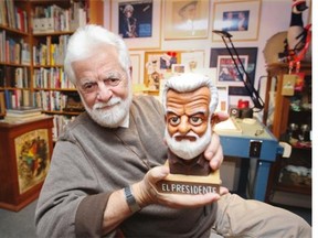 Terry Mosher, a.k.a. Aislin, with a bust of himself created by Quebec City cartoonist Christian Daigle, a.k.a. Fleg, to mark Mosher’s heading the Canadian Association of Editorial Cartoonists from 2009 to 2012, at his home in Lachine, west of Montreal on Tuesday September 30, 2014. His 47th book, The Wrecking Ball, has just been released.
