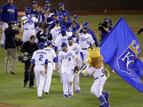 The Kansas City Royals celebrate after Game 2 of baseball's World Series against the San Francisco Giants Wednesday, Oct. 22, 2014, in Kansas City, Mo. The Royals won 7-2 to tie the series at 1-1.