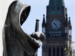 The statue "Truth" stands by the entrance of the Supreme Court of Canada.