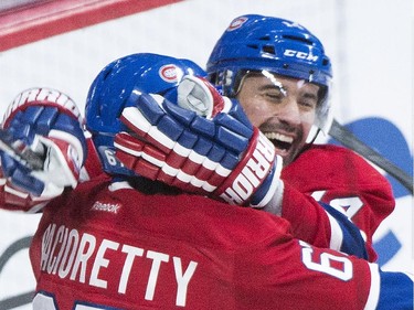 Montreal Canadiens' Tomas Plekanec, right, celebrates with teammate Max Pacioretty after scoring against the New York Rangers during first period NHL hockey action in Montreal, Saturday, October 25, 2014.