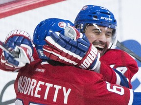 Tomas Plekanec celebrates with Max Pacioretty after scoring against the New York Rangers at the Bell Centre on Oct. 25, 2014. The Canadiens won the game 3-1